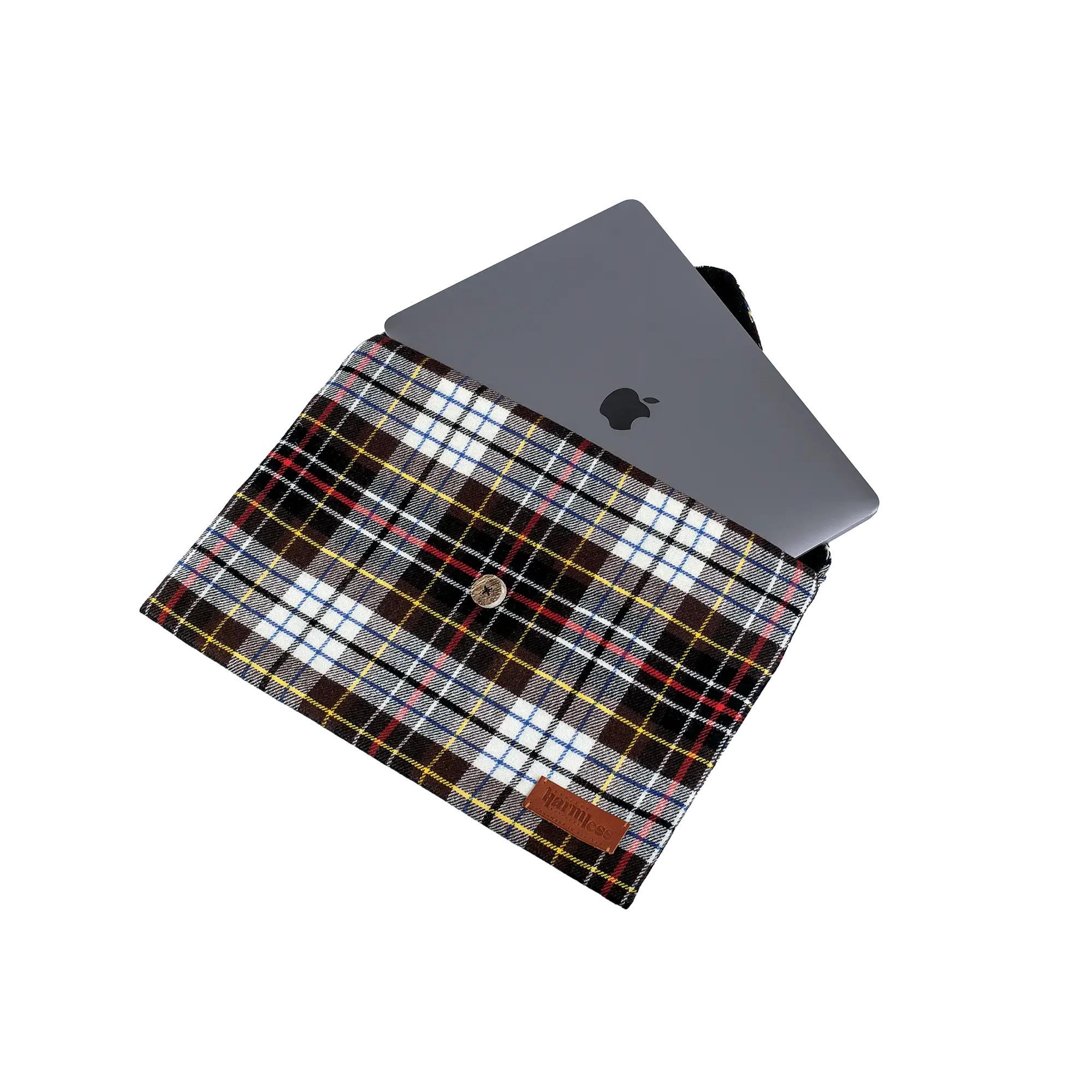 MacBook Air inside the Project Harmless Atelier MacBook Air Case in tartan, showing the snug fit, pure wool lining, handcrafted Scottish deer antler button closure, and a leather patch reading ‘Project Harmless - Handmade in Scotland.