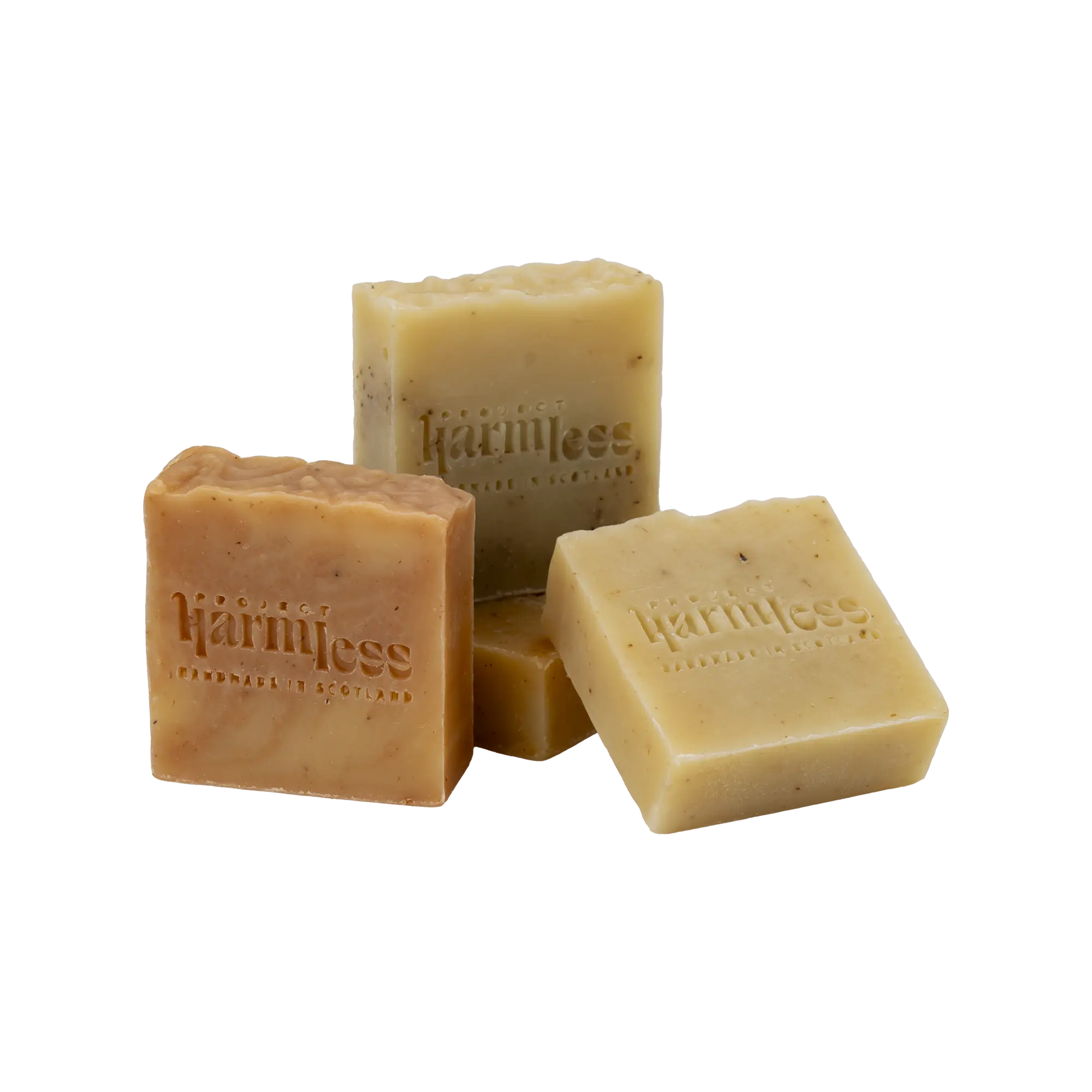 A gift set of 4 Harmless Apothecary Handmade Soaps with 'Project Harmless' logo and text 'Handmade in Scotland' stamped