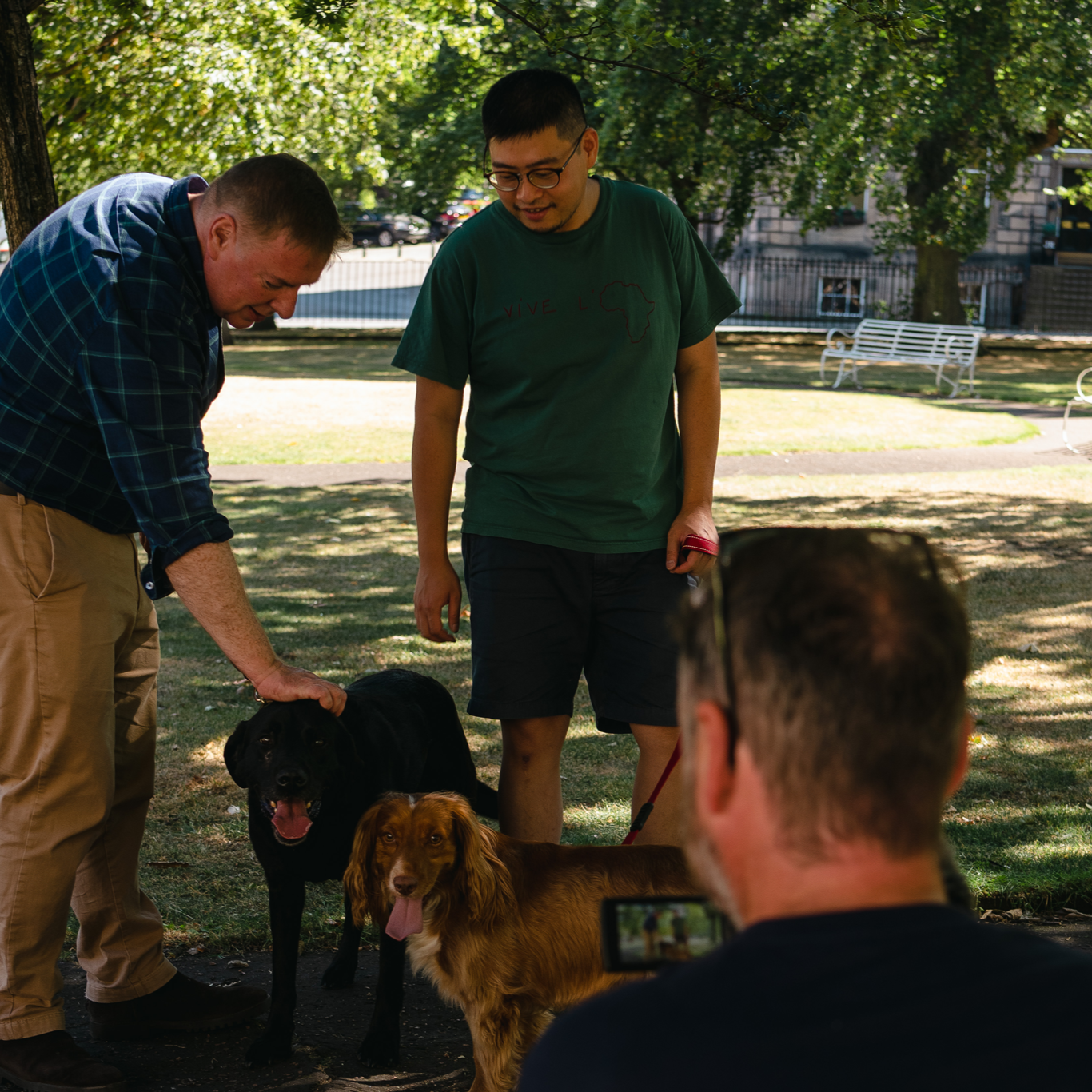 STV News interviewing Project Harmless founders in Edinburgh, with an STV News cameraman filming and two dogs present.