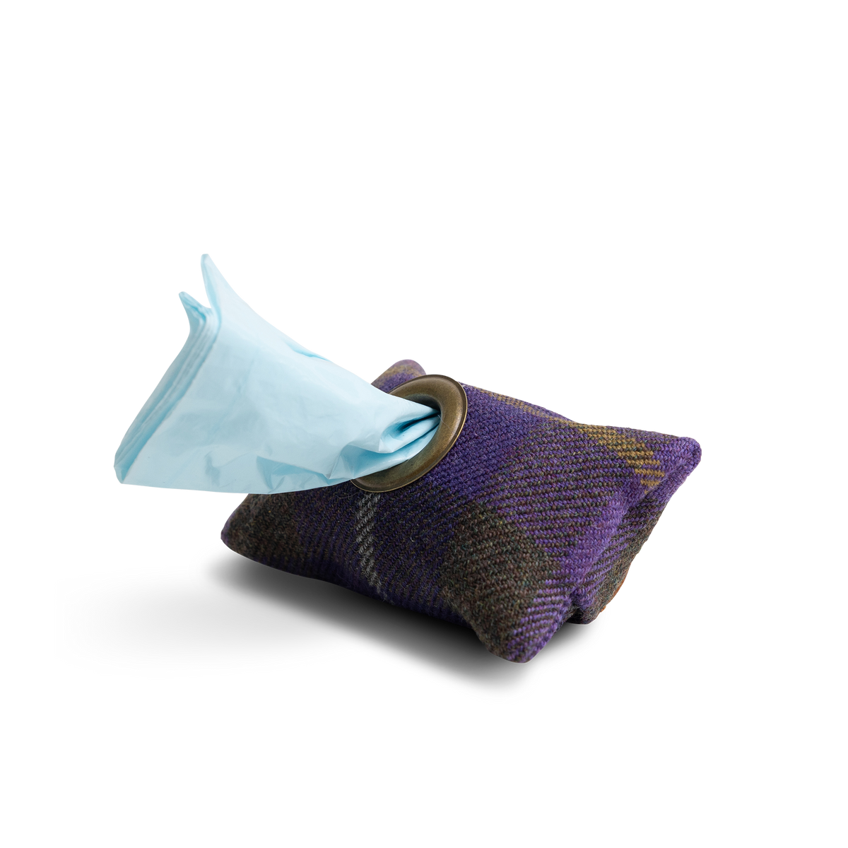 A limited edition tartan dog poo bag holder in a purple and brown plaid pattern, with a light blue Project Harmless poop bag protruding from a circular opening.