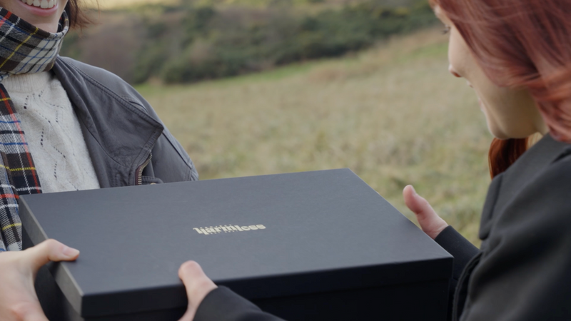 15-second video showing a handcrafted Scottish scarf made from tartan wool being wrapped as a thoughtful gift. Close-up of natural textures, slow hands folding recycled paper, and a stamped Project Harmless label. A premium Scottish gift presented as a meaningful, sustainable choice for Christmas, birthdays and special occasions.